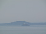 SX03495 Lighthouse and islands in the mist.jpg